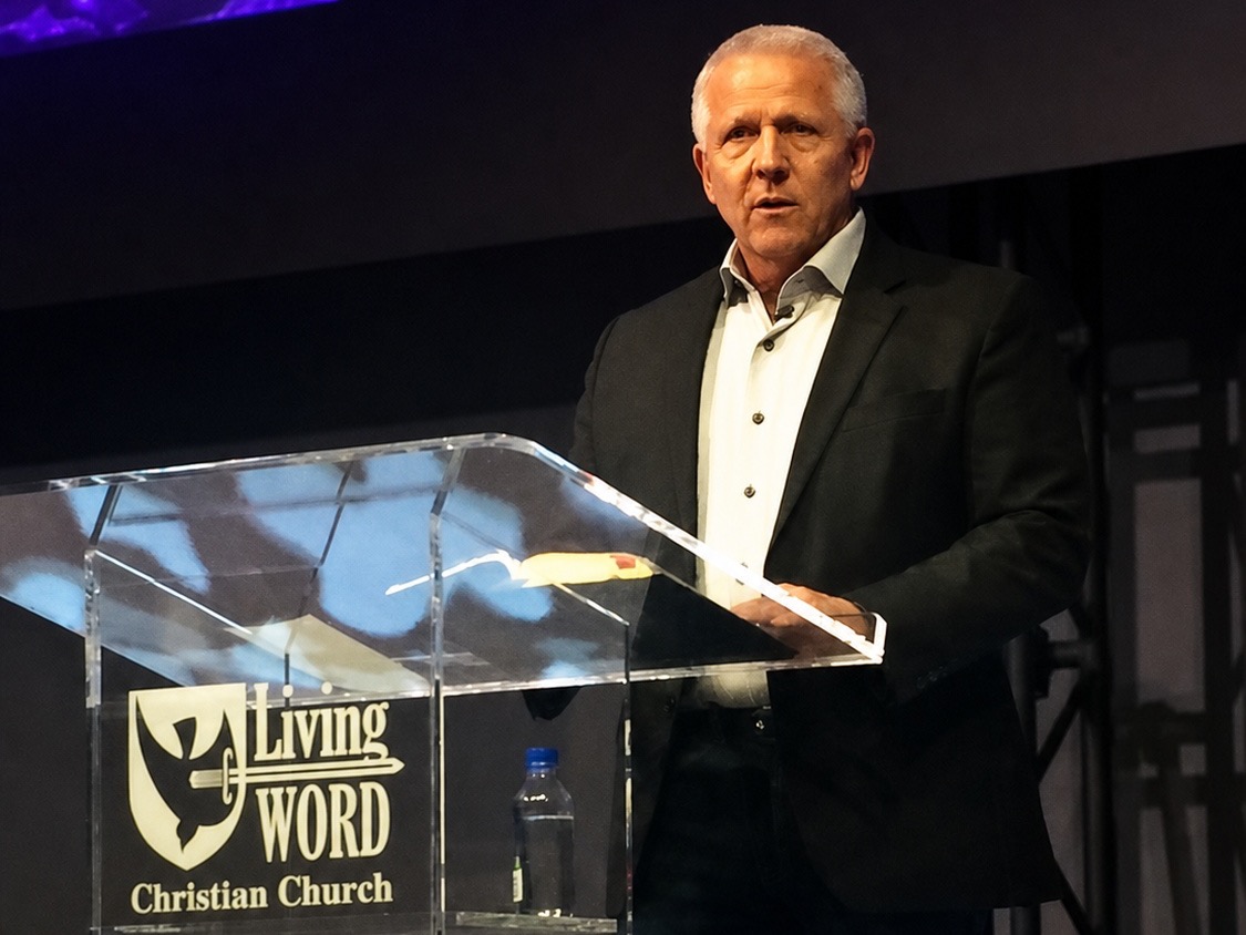 Jim Hall teaching from a church pulpit