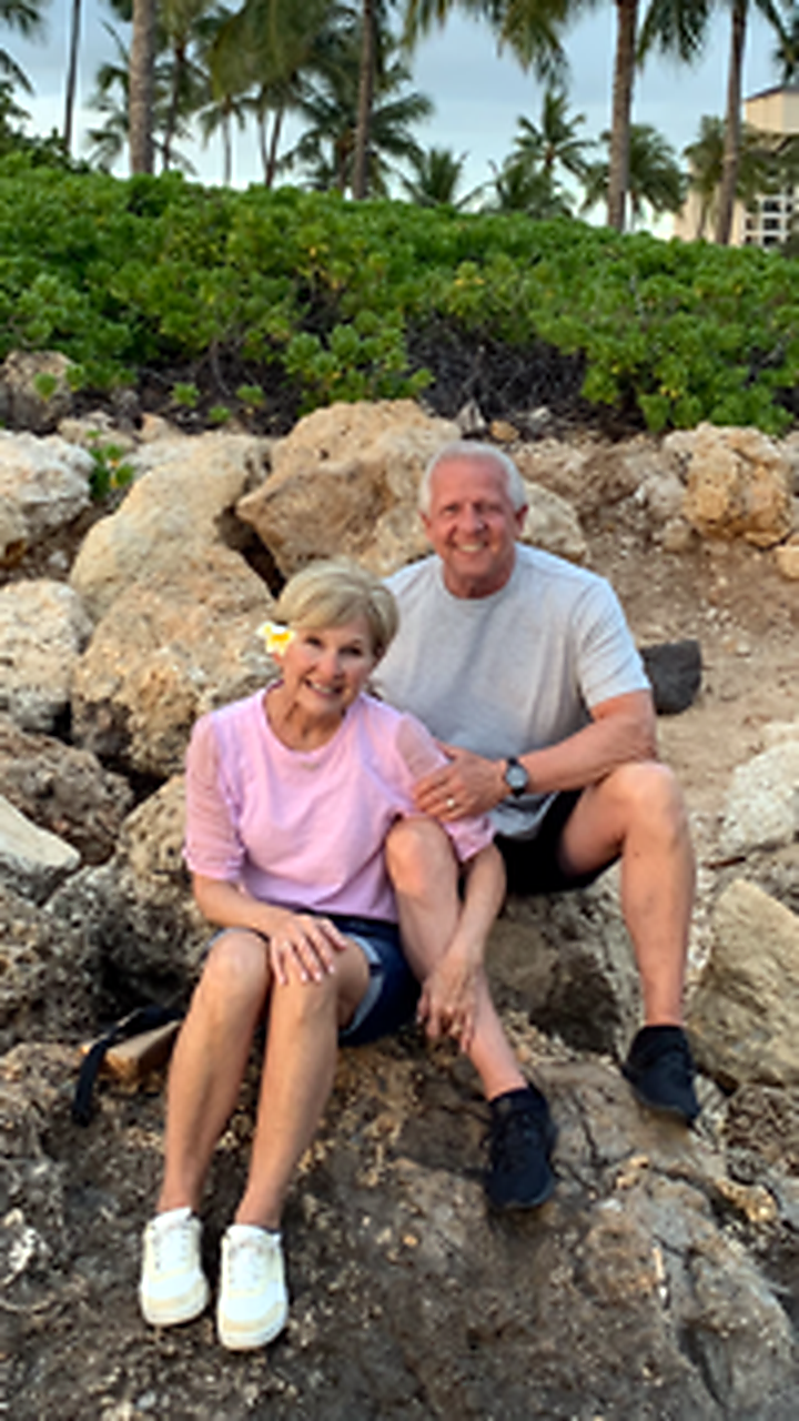 Jim and Sheree sitting together outdoors