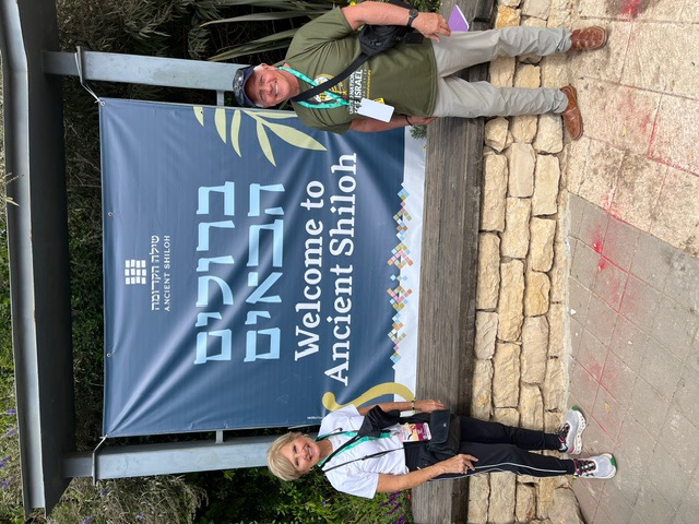 Jim and Sheree at the Welcome to Ancient Shiloh sign, Israel